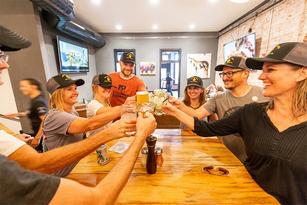 Friends toast at P-Town Pizza.